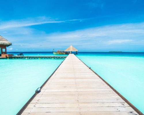 Beautiful tropical Maldives resort hotel and island with beach and sea on sky for holiday vacation background concept - Boost up color Processing