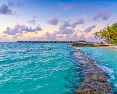 Beautiful sunset with sky over calm sea  in tropical Maldives island