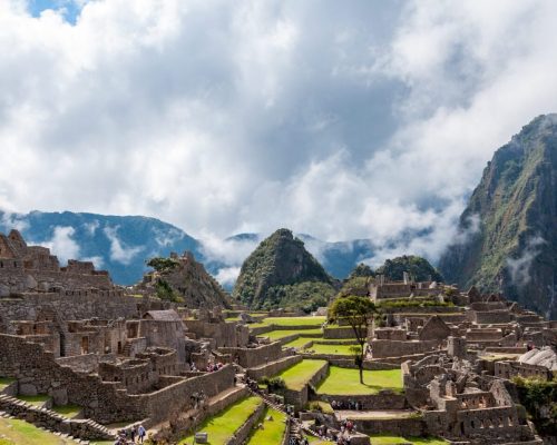 A vertical shot of the mesmerizing Machu Picchu mountain on a cloudy day