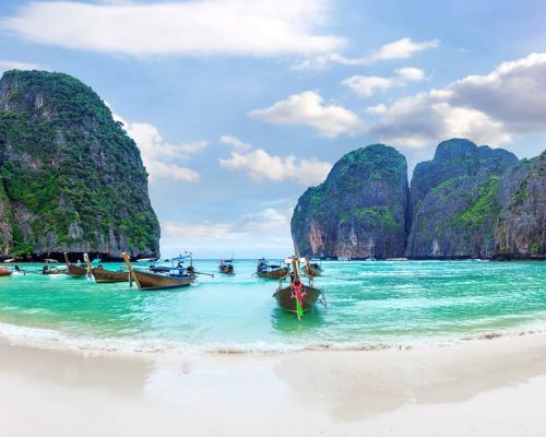 Panorama of Long boat and blue water at Maya bay in Phi Phi Island, Krabi Thailand.