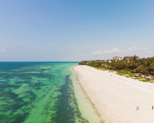 A high angle shot of the beautiful beach and the ocean captured in Mombasa, Kenya